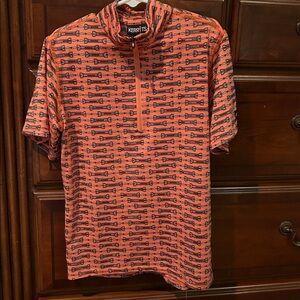 Kerrits Equestrian Top in Vibrant Orange with bit pattern